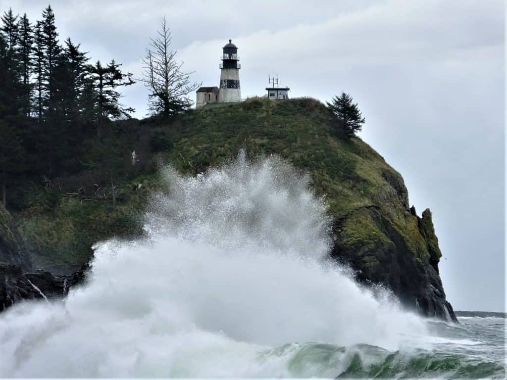 Cape Disappointment Light House Waves Crashing Washington Coast.  This is a big wave I think that the splash is about forty feet high.  This is the kind of thing you get when it is stormy on the Oregon coast (even though technically Cape Disappointment is in Washington. 