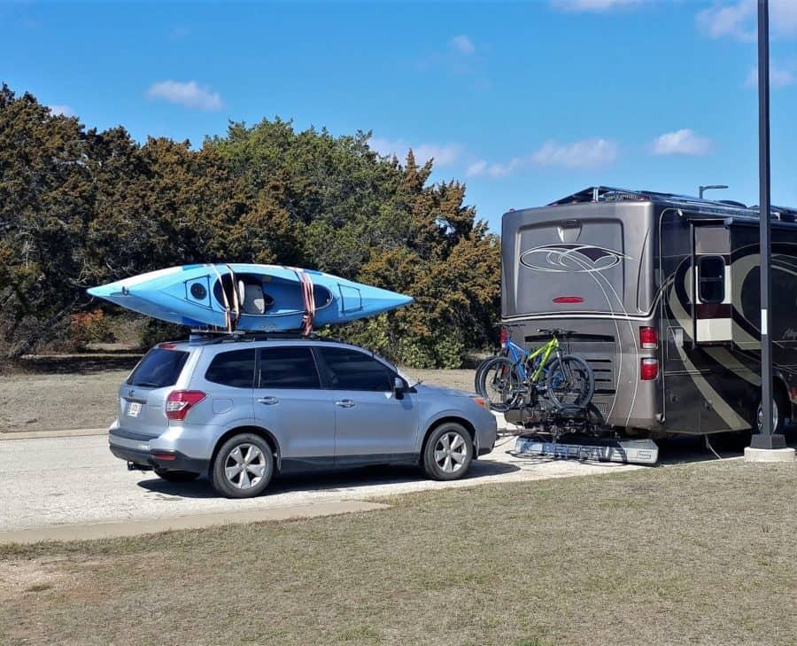 Here is a picture of the bikes on the rack between our RV and the car. (The last two pictures were of my old bike rack but this still illustrates the layout.) 