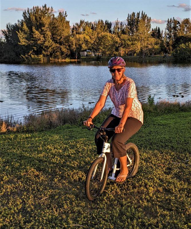 Tami taking a spin on the JackRabbit e-bike in southern Florida, do you see the gator?  Me neither. 