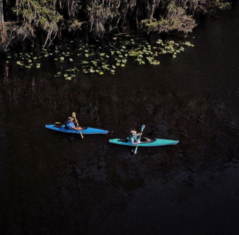 Drone "sky camera" shot of kayak movie stars Scott and Tami filming the action-adventure thriller. 