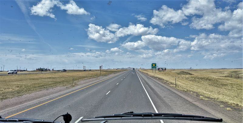 Driving across Wyoming In this picture, and others, you can see more bugs on our windshield.