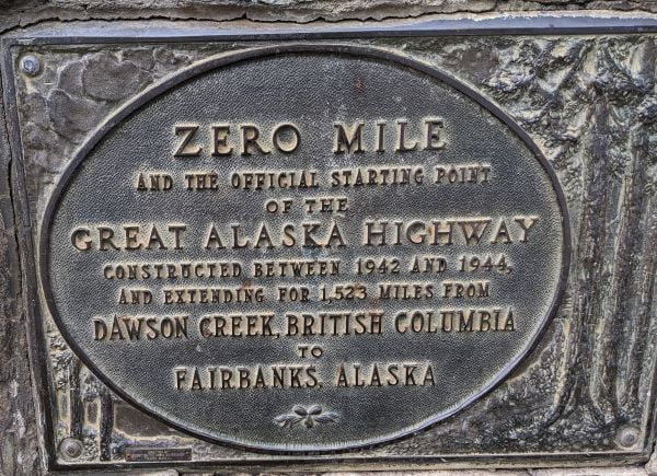 Plaque on the side of the mile zero cairn at the start of the Alaska Highway.