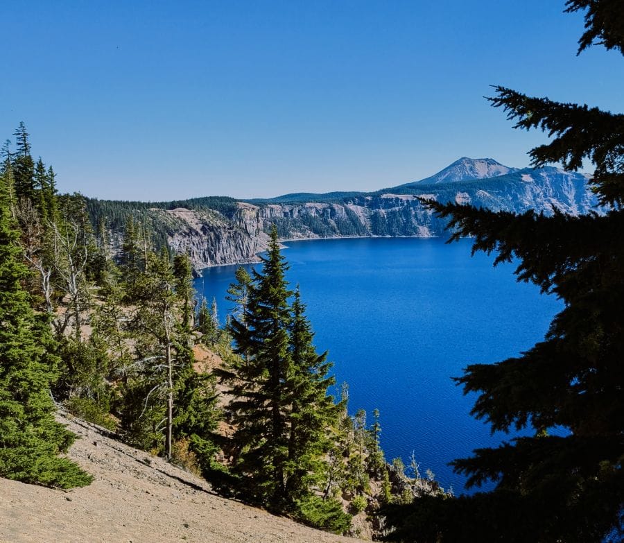 The mountain in this photo, on the far side of Crater Lake is Mount Scott. The trail around Crater Lake departs the rim and goes towards Mount Scott.