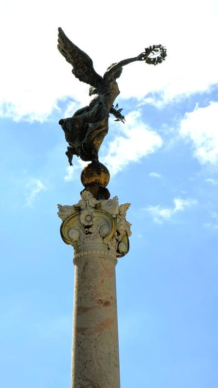Monument of Victor Emmanuel II di Savoia in Rome 11 The sun is behind this two angelic bronze angle but the angle shows the laurel wreath on the Victor Emmanuel II National Monument. Photo from FoxRVTravel Monument of Victor Emmanuel II.