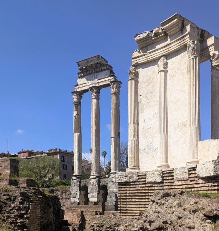 The Temple of Vesta on the right and The Temple of Castor and Pollux (there columns on the left side of the photo). Photos are from the FoxRVTravel article “The Roman Forum.”