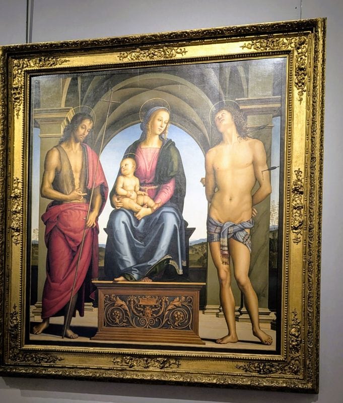 Pietro di Cristoforo Vannucci, known as Perugino 1523 Virgin and Child enthroned between SS. Sebastian and John the Baptist 1493 Oil on panel Photo from FoxRVTravel article "Masterpiece paintings at the Uffizi Gallery" 