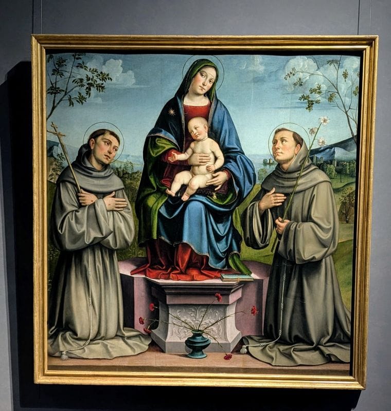Francesco Francia, real name was Francesco Raibolini Madonna and Child Enthroned with Saint Francis and Saint Anthony of Padua C. 1500-1502 oil on panel Photo from FoxRVTravel article "Masterpiece paintings at the Uffizi Gallery" 
