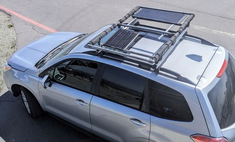 Our car quit at the worse possible time. 4 My car roof rack holding my 50-watt and my 25-watt solar panels.