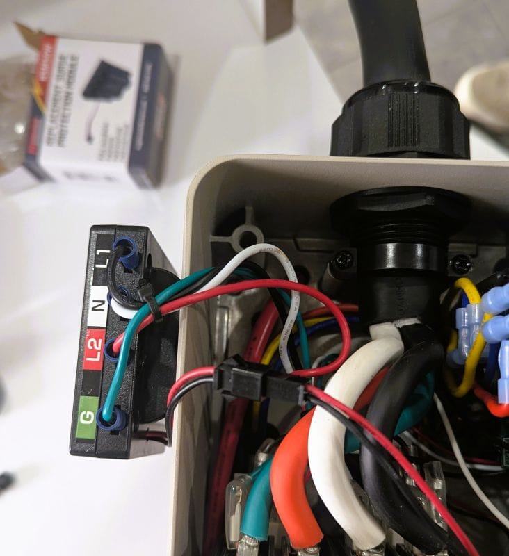 To remove the surge protector module you need to lift the small plastic box out of the Watchdog Powercenter so you can disconnect the wires.