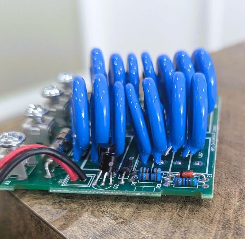 The internal components including the blue MOVs inside the surge protector module.
