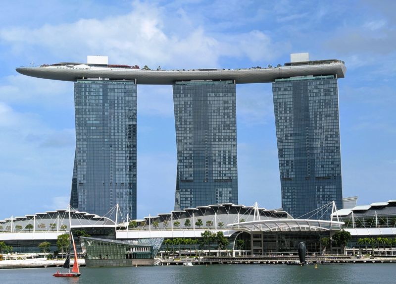 The Bay Marina Hotel and Casino is one of Singapore's newest masterpieces I heard a cost number of a billion dollars. The roofline is representative of cargo ships.