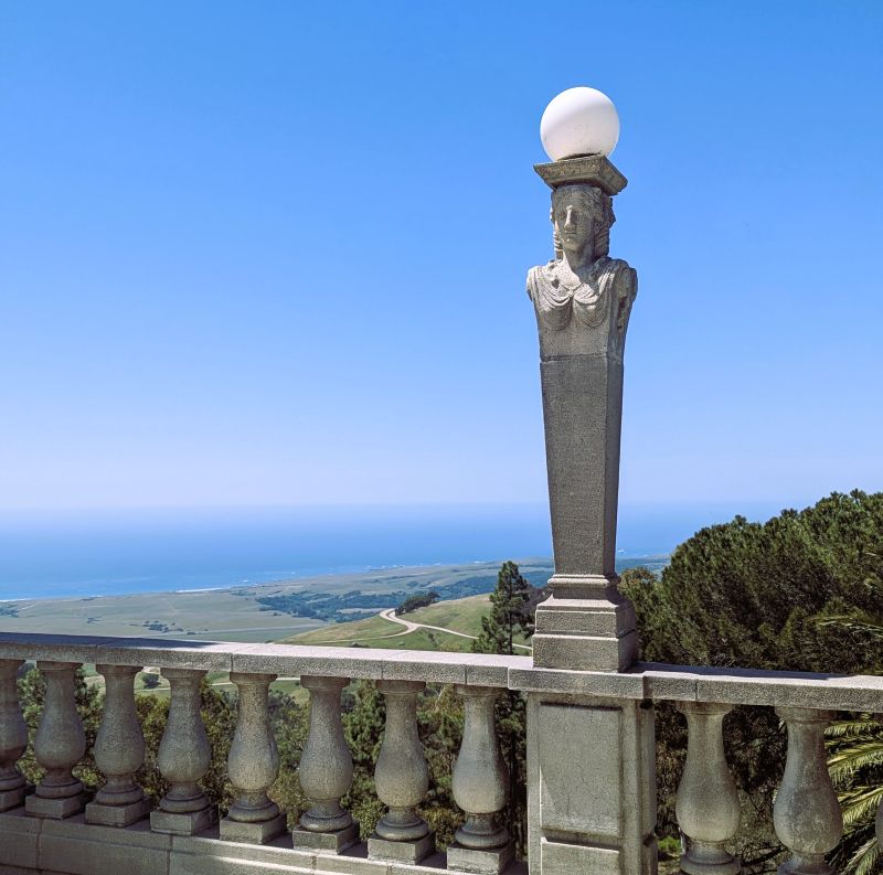 At the Hearst Castle you can't have a view without also having an art piece, in this case holding a lamp.