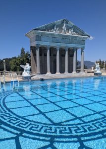 The pool at the Hearst Castle appears to be a Greek style. While the columns were built during the construction, many of the elements including the statue of Neptune at the top are original art pieces.