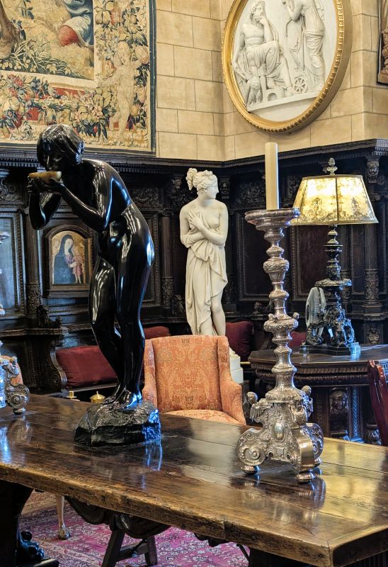 One of the corners in the Great Room at the Hearst Castle is dedicated to statues. Above the statues are original antique one of a kind tapestries.