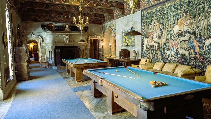 After dinner the guests retired to the billiard room at the Hearst Castle. On the wall is a tapestry depicting a hunting scene. There is a copy of this tapestry displayed in an European museum.
