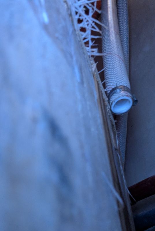 The first time I saw the hose, without the fitting attached was with the snake camera. If you look carefully you can see the cold water hose behind this one. But, where are the pipes?