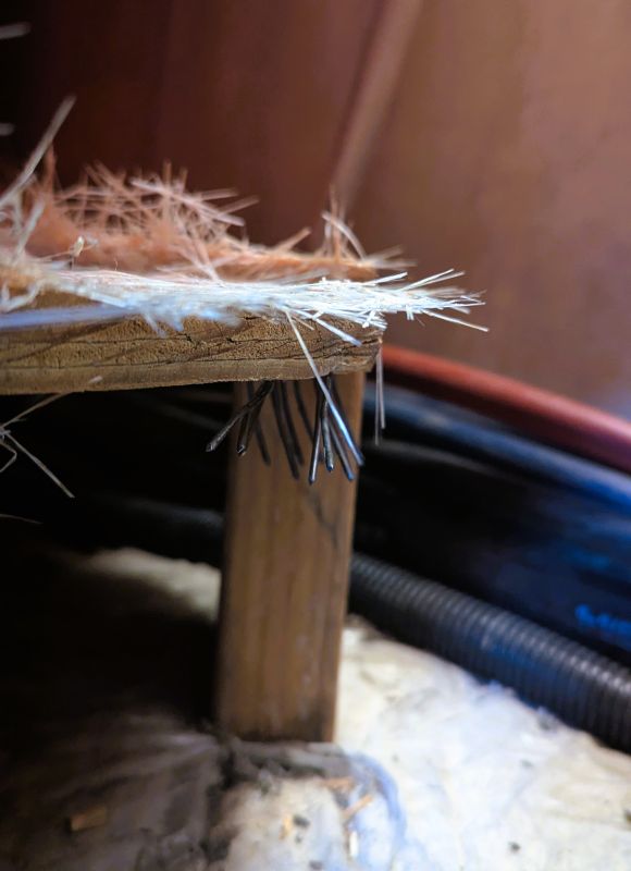 This photo shows the pipes clearly after I removed the first of the two 2x4 support blocks under the edge of the shower.