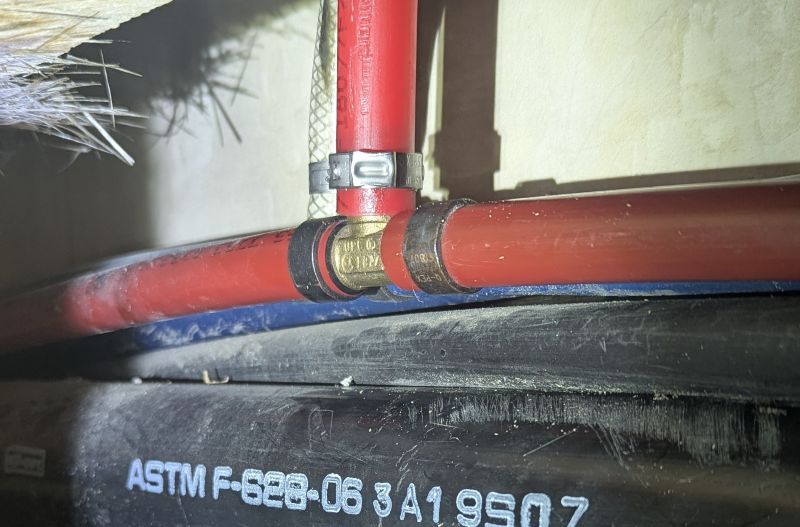 This was the photo taken right before clamping the stainless steel ring on the new pipe.
