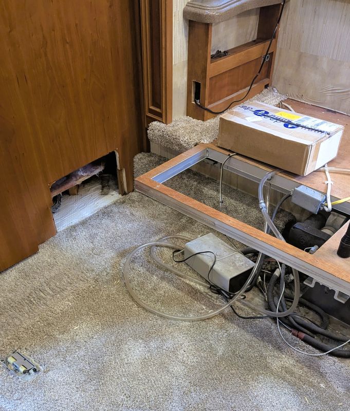 Finally with enough stuff removed I can lay down on the still wet carpet and look at the problem with my own eyes.
