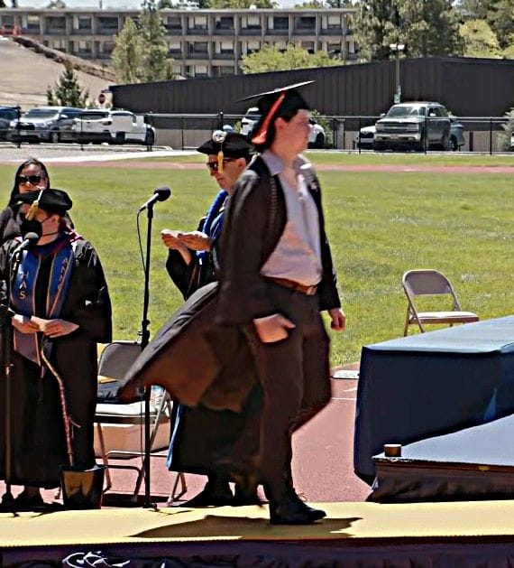 Brady crossing the stage during his graduation. This was a screen shot taken from the YouTube live feed.
