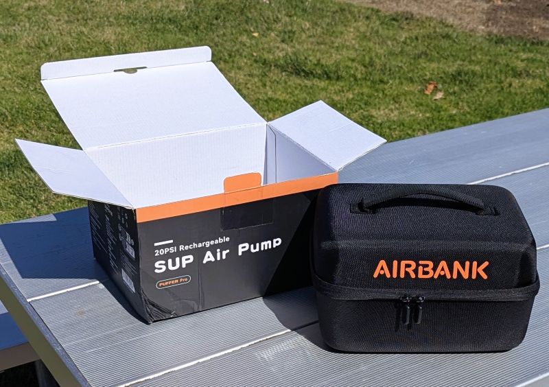 Our AIRBANK PUFFER Pro Rechargeable Pump with the box (long discarded) and protective clam shell semi soft zipper case.