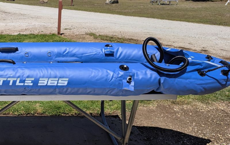 Our kayaks look pretty sad when they are not fully inflated. I am making adjustments to make sure everything is in the right place during the inflation.