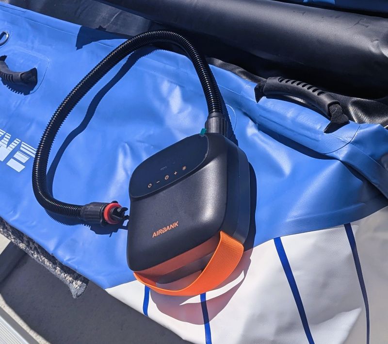 Our AIRBANK PUFFER Pro Rechargeable Pump sitting on our kayak ready to be inflated.