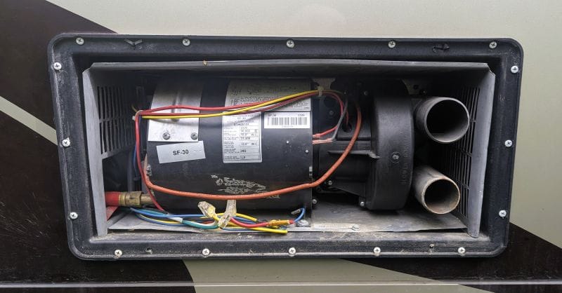 Winter started at the end of June. 8 This is what the furnace looked like when I started the repair. The combustion fan is located to the right of the photo next to the air inlet and exhaust tubes.