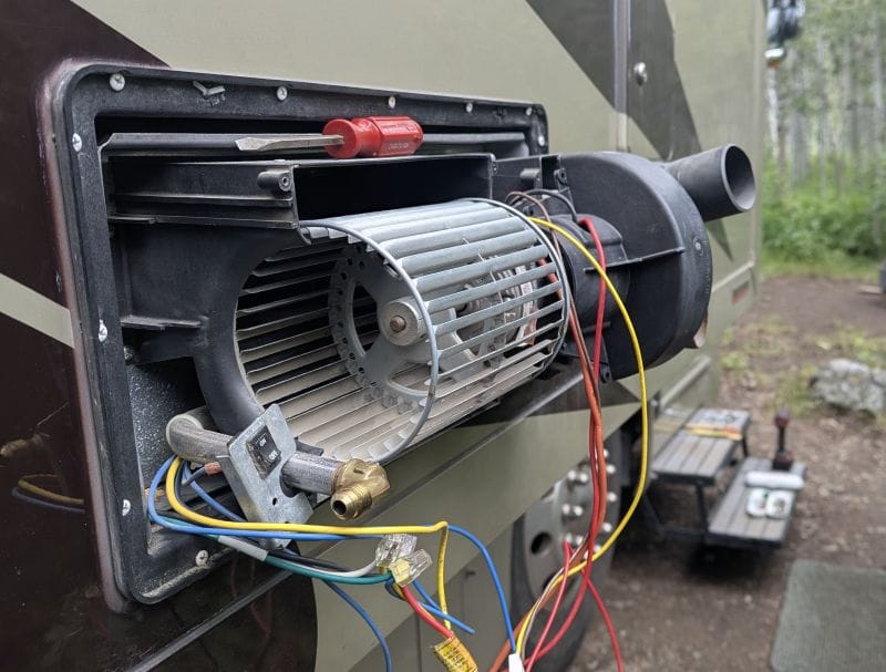 Winter started at the end of June. 13 This photo was taken after I pulled the correct part of the furnace out of the side of the RV and removed the shroud around the blower fan. At this point I still had not yet determined the problem.