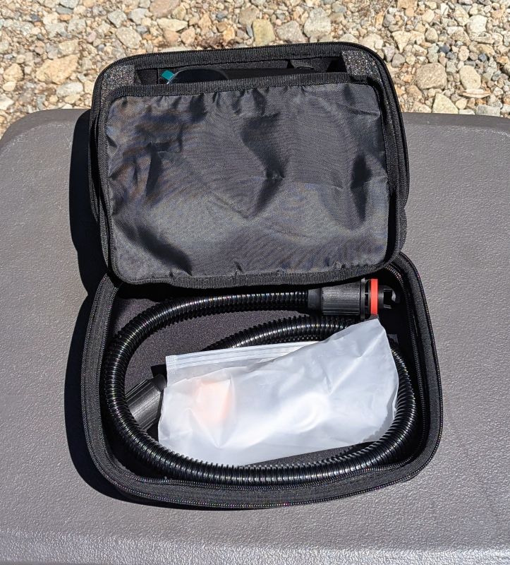 Our AIRBANK PUFFER Pro Rechargeable air ump with hose stored in a separate pouch inside the carrying case.