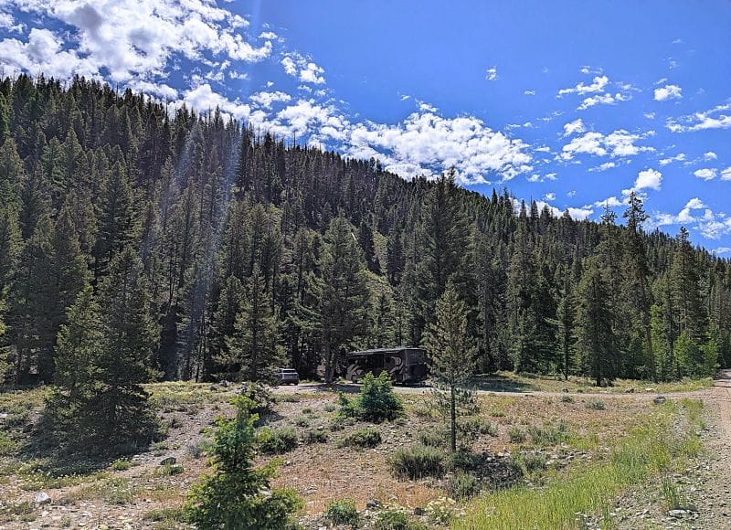 The view of our RV in our boondocking spot as seen from Baker Creek.