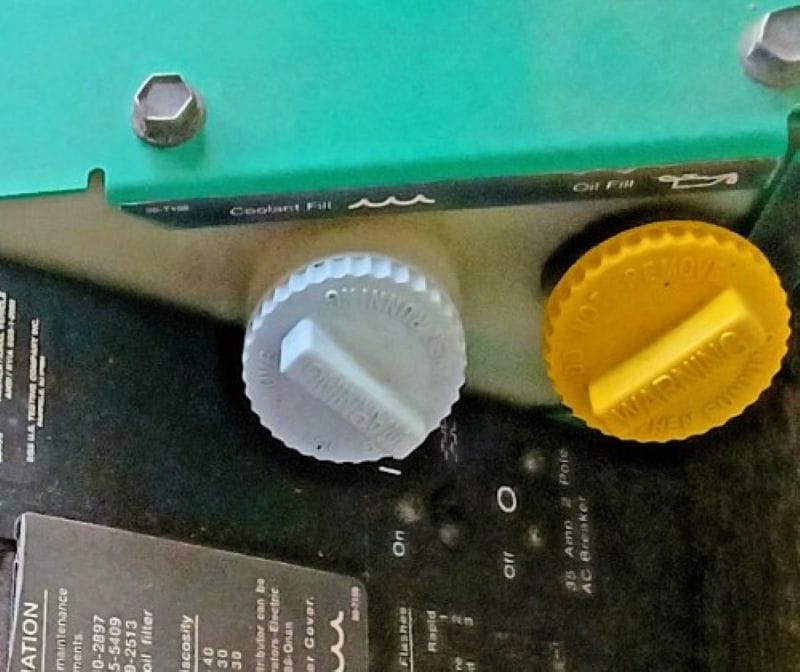 Then our generator failed. 30 Oil fill and dip stick cap on the right. Coolant cap on the reservoir on the left.