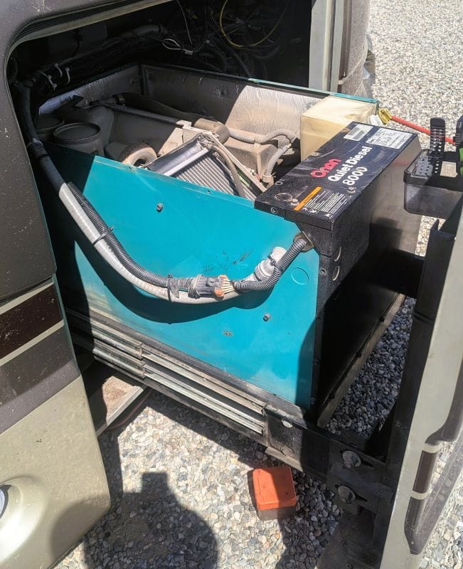 Then our generator failed. 25 My generator (passenger side) extended as far as it will go at the front of my RV.